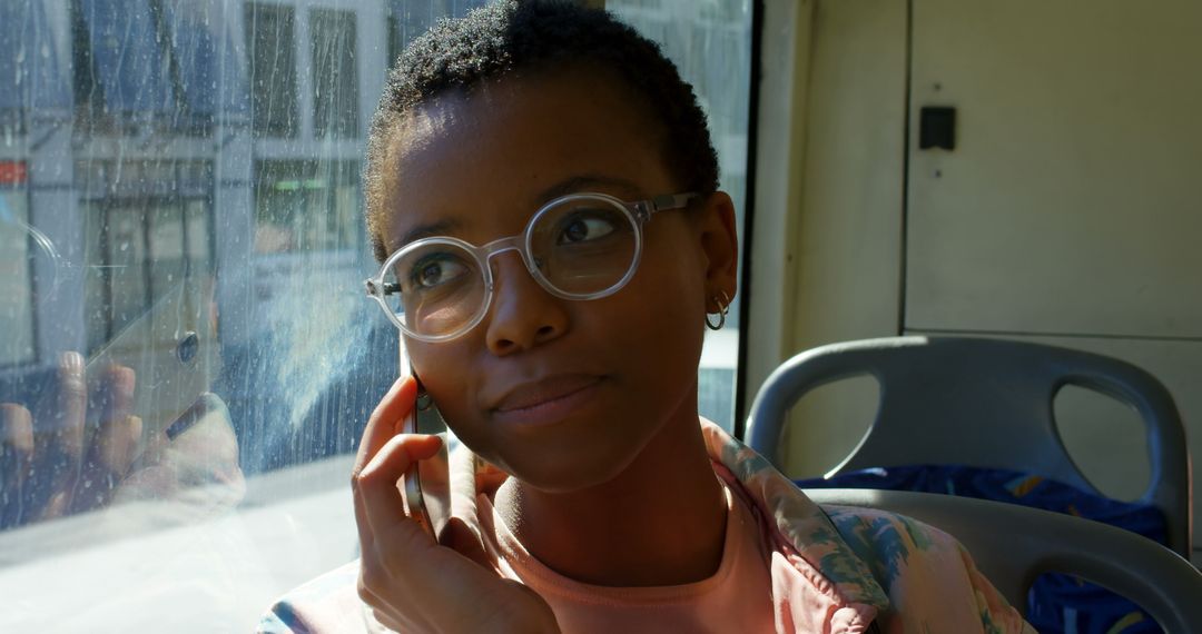 Urban Female Commuter Using Mobile Phone on Bus Ride