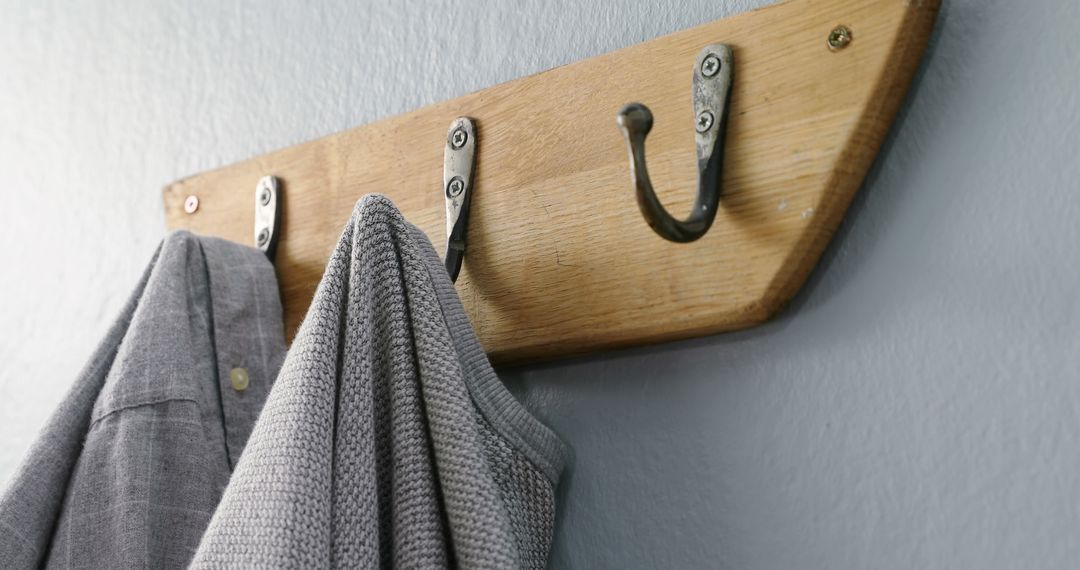 Wooden Coat Rack with Clothes Hanging on Wall - Free Images, Stock Photos and Pictures on Pikwizard.com