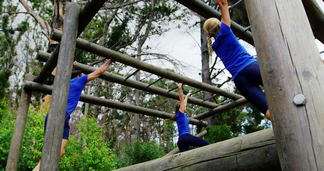 Group Exercising on Outdoor Jungle Gym for Fitness Training - Free Images, Stock Photos and Pictures on Pikwizard.com