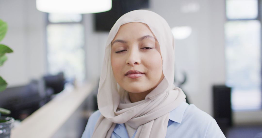 Confident Muslim Businesswoman Wearing Hijab in Modern Office - Free Images, Stock Photos and Pictures on Pikwizard.com