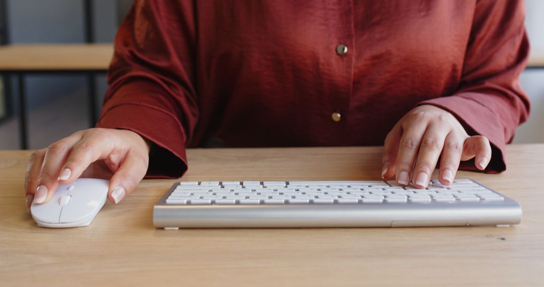 Business Professional Working at Desk with Keyboard and Mouse