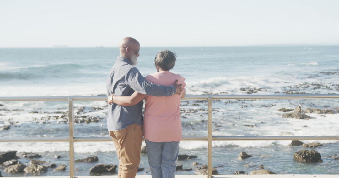 Elderly Couple Embracing Near Ocean, Enjoying Scenic View Together - Free Images, Stock Photos and Pictures on Pikwizard.com