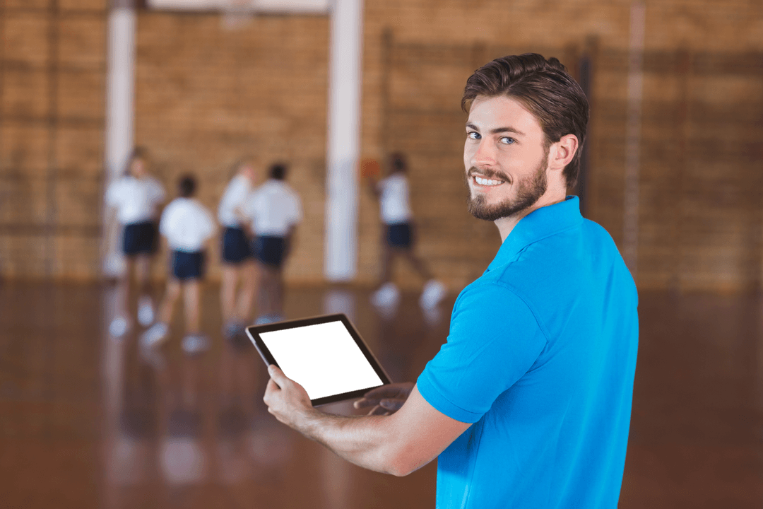 Smiling Coach with Digital Tablet in Transparent Gym Setting