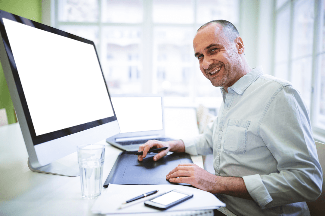 Portrait of Smiling Businessman in Office with Transparent Screens