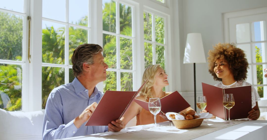 Diverse Group Enjoying Fine Dining Experience in Sunlit Room