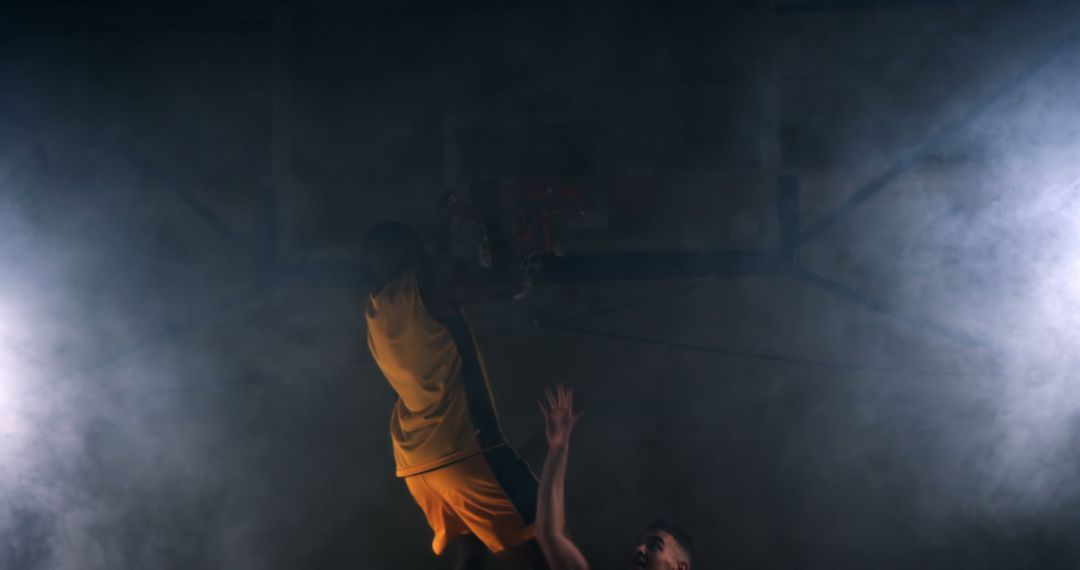 Intense Basketball Dunk in Dramatic Smoke-filled Arena - Free Images, Stock Photos and Pictures on Pikwizard.com