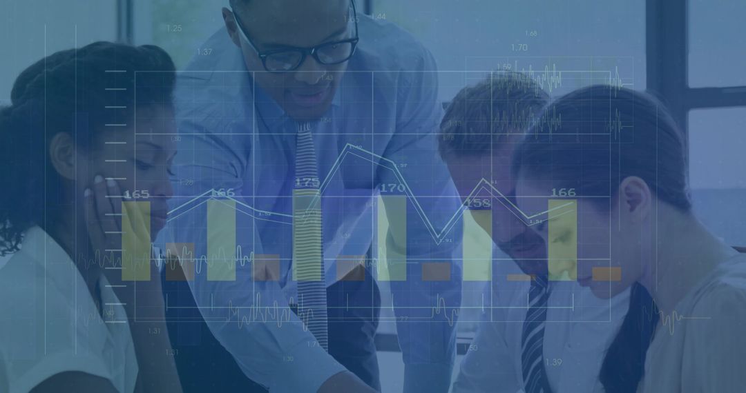 Diverse Business Team Analyzing Financial Data and Graphs on Laptop