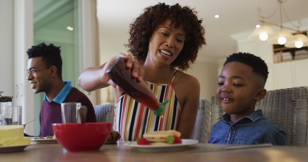 African American Family Having Breakfast Together at Home - Free Images, Stock Photos and Pictures on Pikwizard.com