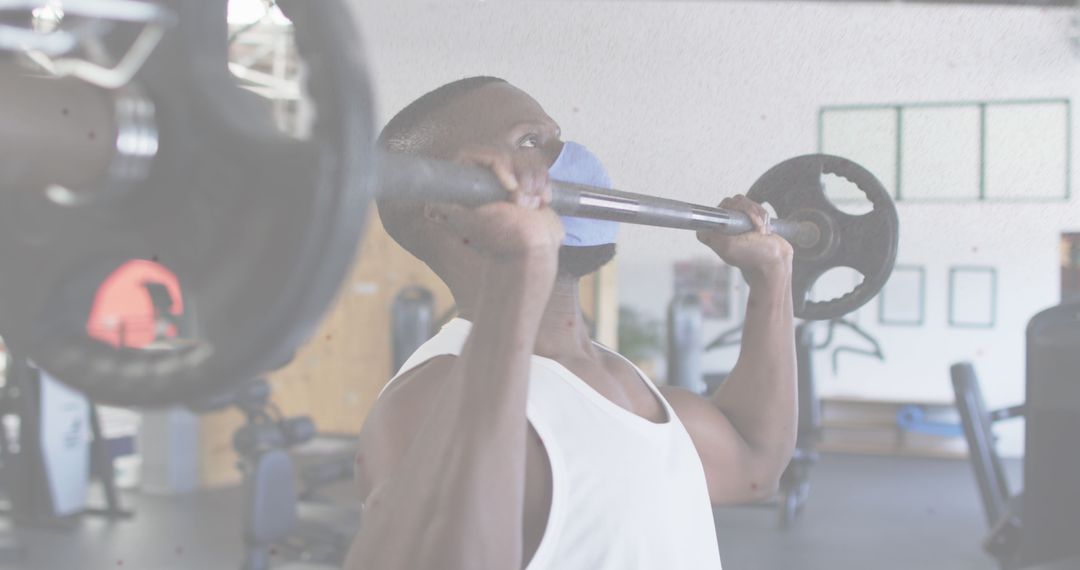 Man Training With Face Mask in Gym during Pandemic