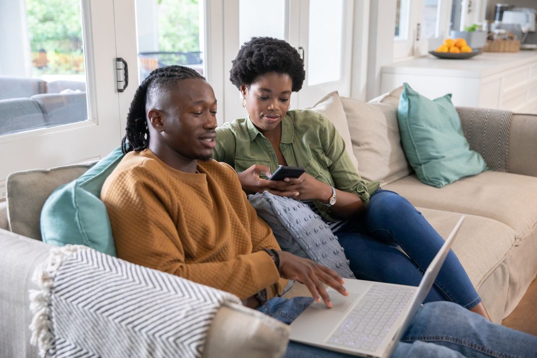 Couple Relaxing at Home Using Gadgets for Digital Lifestyle