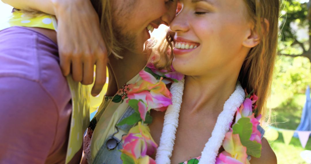 Happy Hipster Couple Embracing at Outdoor Festival - Free Images, Stock Photos and Pictures on Pikwizard.com