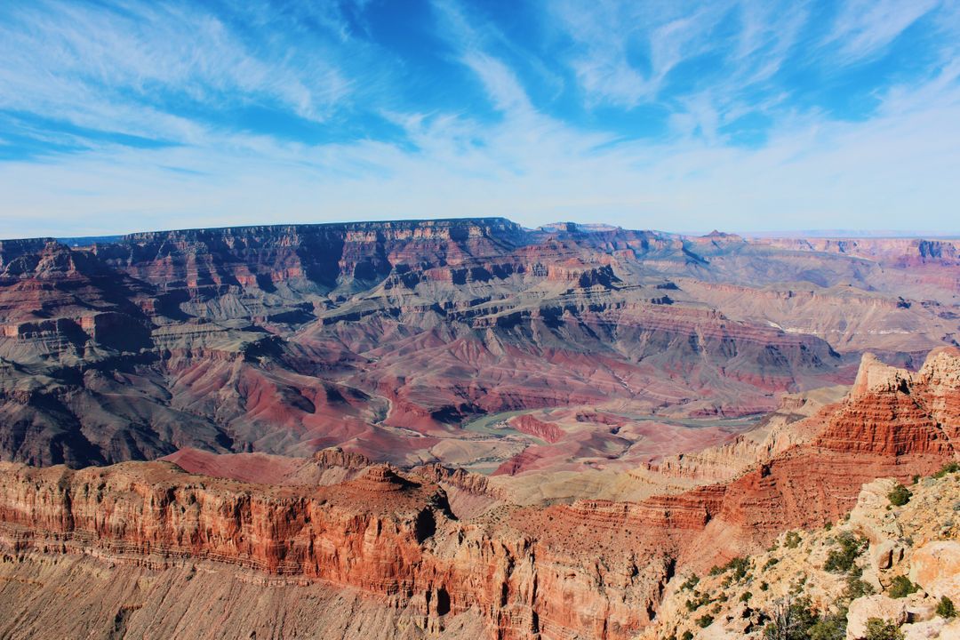 Breathtaking View of Grand Canyon Under Bright Blue Sky - Free Images, Stock Photos and Pictures on Pikwizard.com