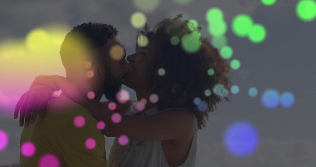 Couple Embraced in Romantic Kiss with Vibrant Bokeh Effect
