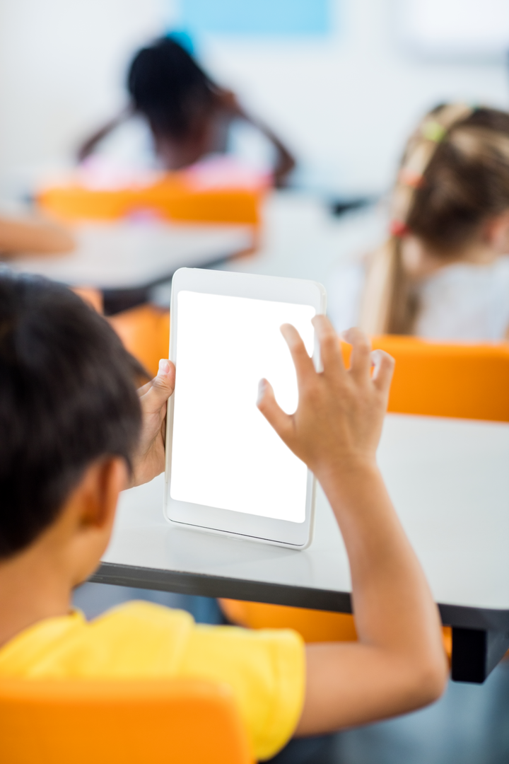 Transparent Tablet Screen Used by Schoolboy in Classroom Scene - Download Free Stock Images Pikwizard.com