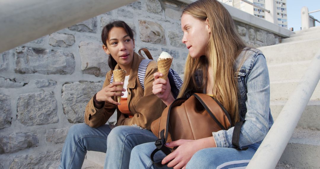 Teen Friends Eating Ice Cream on Outdoor Stairs - Free Images, Stock Photos and Pictures on Pikwizard.com