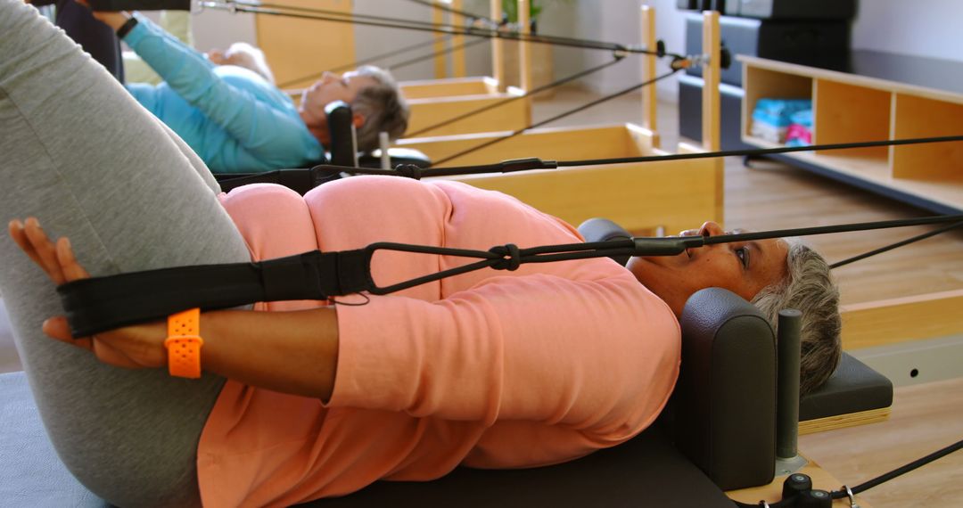 Senior Women Participating in Pilates Reformer Class for Fitness - Free Images, Stock Photos and Pictures on Pikwizard.com