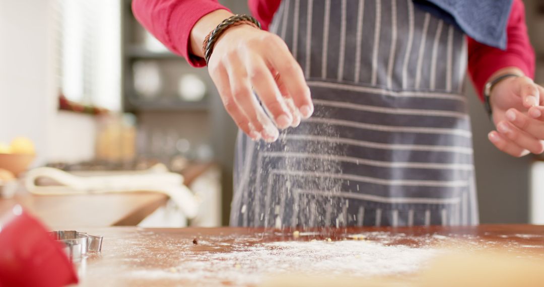 Close-Up of Baker Sprinkling Flour While Cooking - Free Images, Stock Photos and Pictures on Pikwizard.com