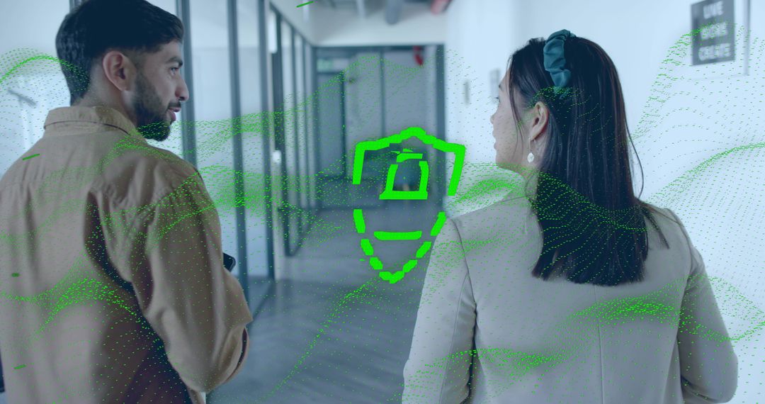 Coworkers Analyzing Green Data with Technology Icon in Office Hallway