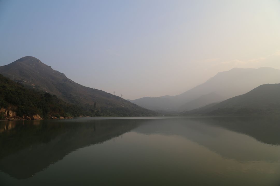 Peaceful Mountain Lake at Dusk with Gentle Mist - Free Images, Stock Photos and Pictures on Pikwizard.com