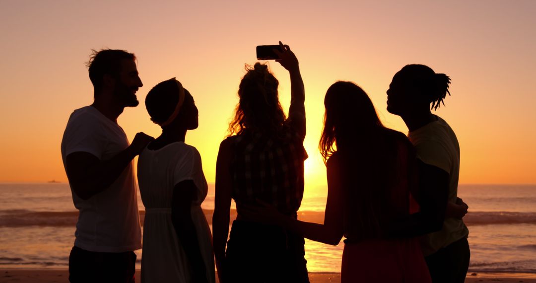 Silhouettes of Friends Taking Selfie at Sunset Beach - Free Images, Stock Photos and Pictures on Pikwizard.com