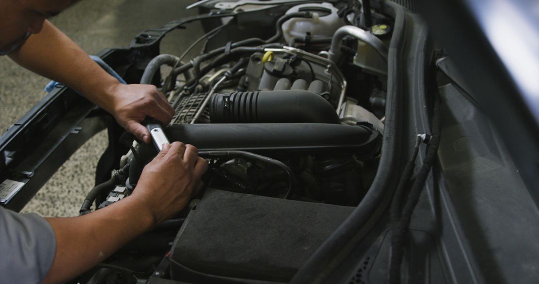 Male Mechanic Repairs Car Engine in Auto Workshop - Free Images, Stock Photos and Pictures on Pikwizard.com