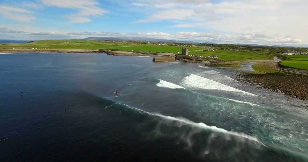 Aerial View of Coastal Landscape with Waves Crashing and Historic Dock - Free Images, Stock Photos and Pictures on Pikwizard.com