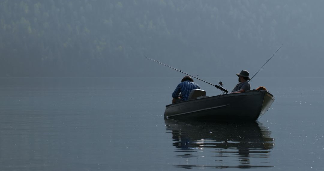 Two Fishermen in Rowboat on Calm Misty Lake Early Morning - Free Images, Stock Photos and Pictures on Pikwizard.com