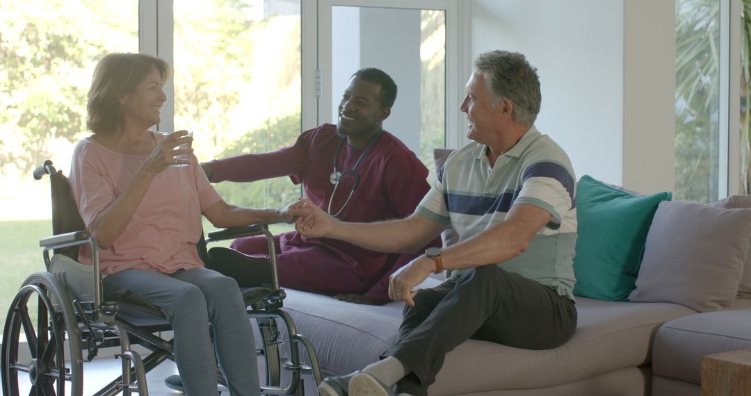 Elderly Couple Enjoying Time with Caring Nurse at Home