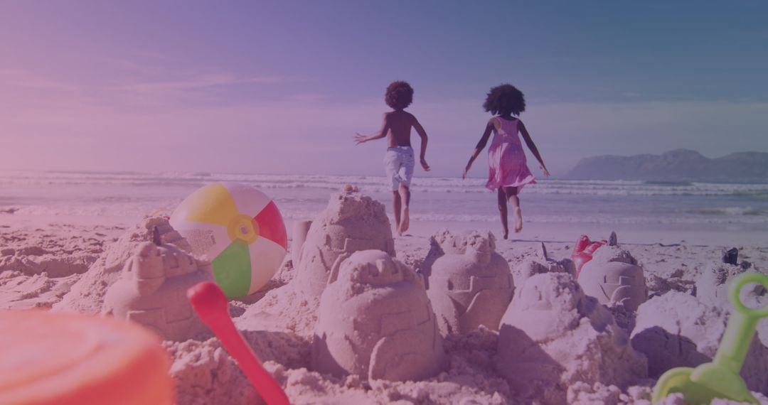 Joyful Siblings Playing at Sunlit Beach