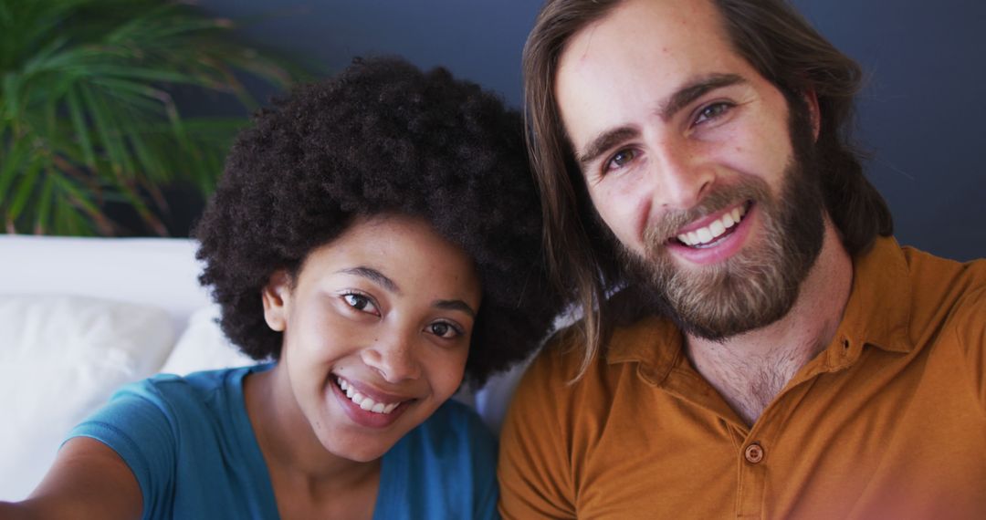Happy Interracial Couple Smiling for Selfie at Home - Free Images, Stock Photos and Pictures on Pikwizard.com