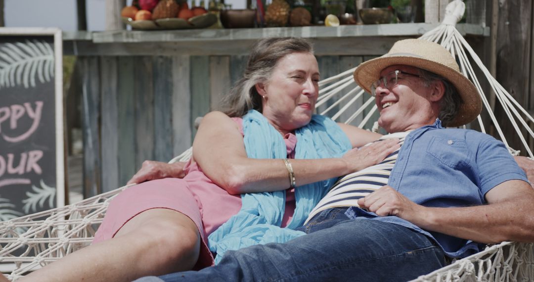 Senior Couple Relaxing on Hammock During Tropical Vacation - Free Images, Stock Photos and Pictures on Pikwizard.com