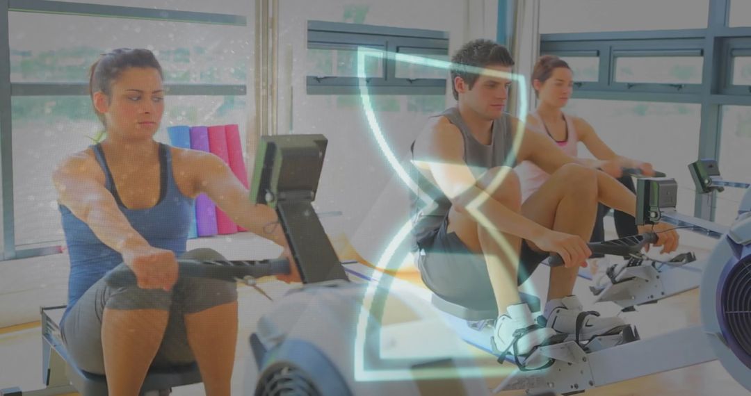 Caucasian Group Rowing in Gym with Digital Overlay
