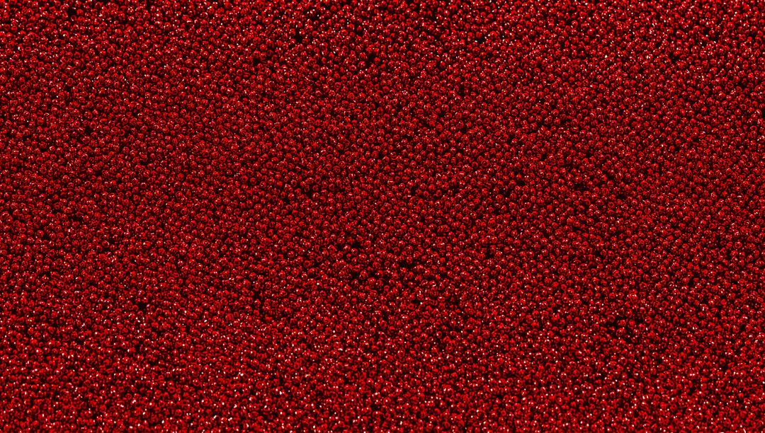 Shimmering Glossy Red Beads Texture with Dense Sparkle and Specular Highlights