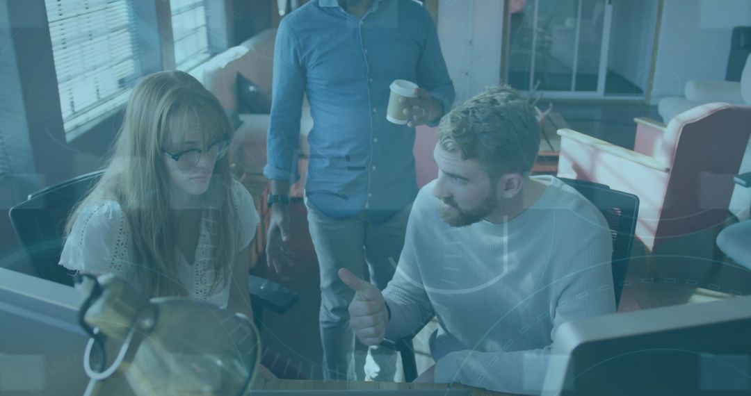 Diverse Business Team Collaborating on Digital Data in Office