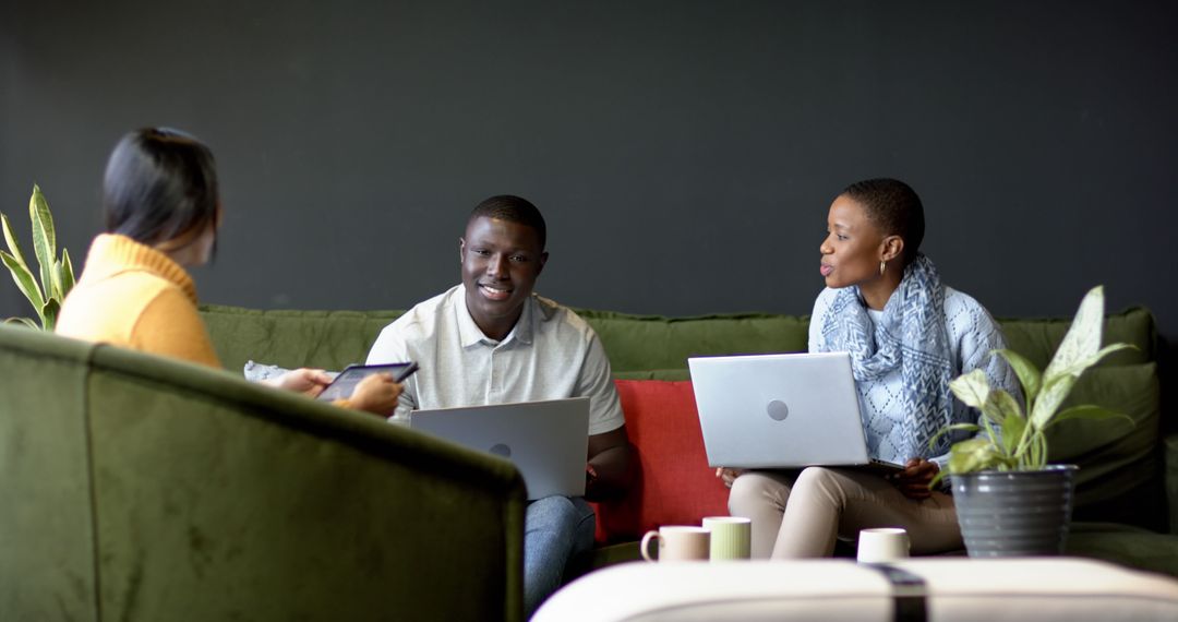 Diverse Team Collaborating in Modern Office Lounge
