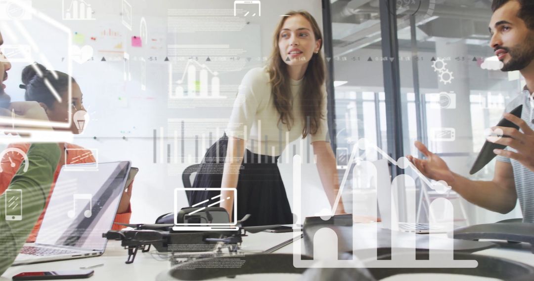 Diverse Team Collaborating on Digital Interface with Data Graphics Overlay