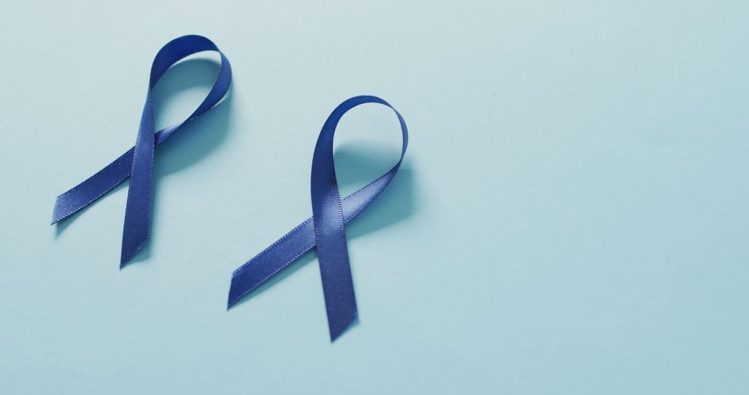 Two Blue Awareness Ribbons on Light Blue Background - Free Images, Stock Photos and Pictures on Pikwizard.com