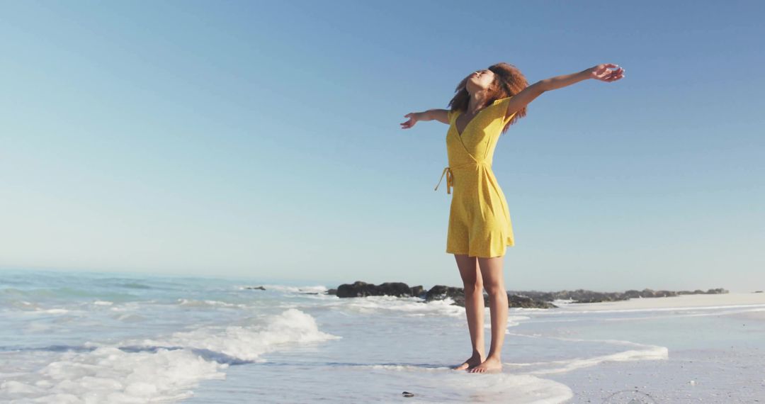 Joyful Woman Embracing Nature at Serene Beach