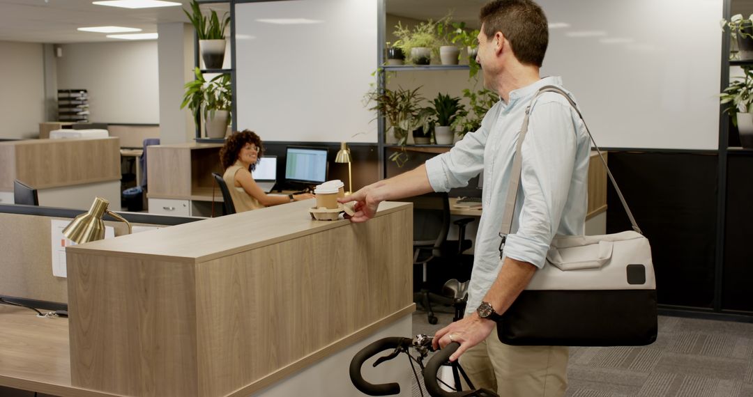 Man Offering Coffee to Receptionist in Contemporary Office