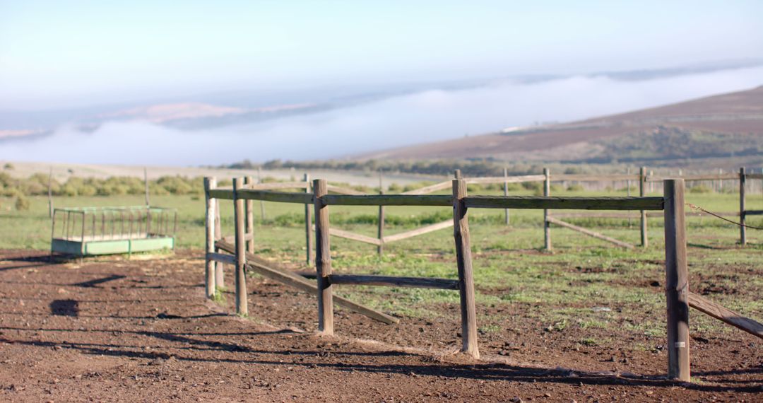 Serene Countryside Fence with Misty Mountain View - Free Images, Stock Photos and Pictures on Pikwizard.com