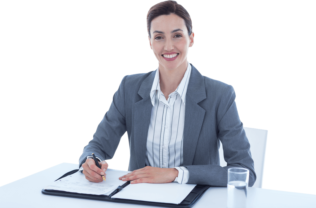Businesswoman Smiling and Writing at Office Desk Transparent Background