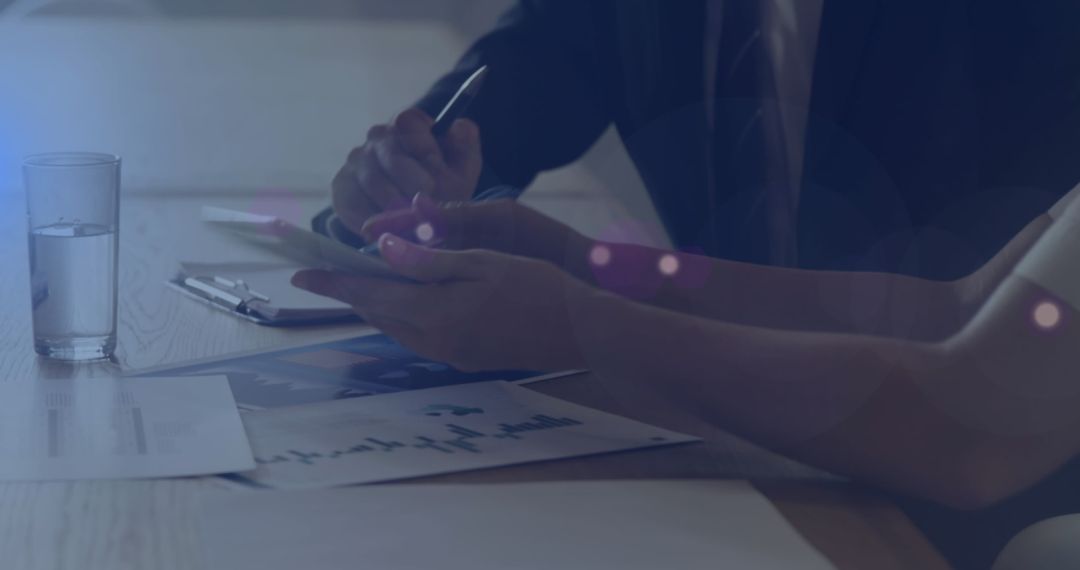 Business Professionals Using Tablet in Corporate Meeting