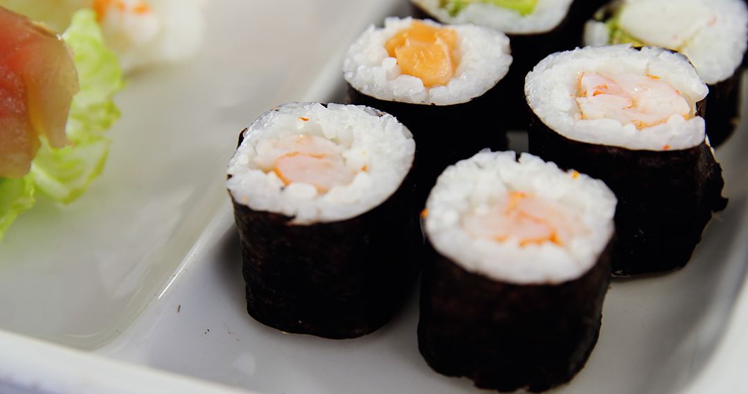 Neatly Placed Sushi Rolls with Salmon on White Tray - Free Images, Stock Photos and Pictures on Pikwizard.com