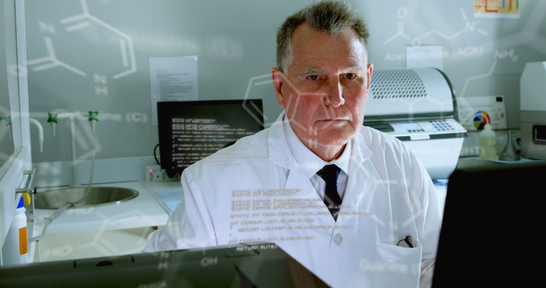 Senior Male Scientist Analyzing Data in Laboratory Setting