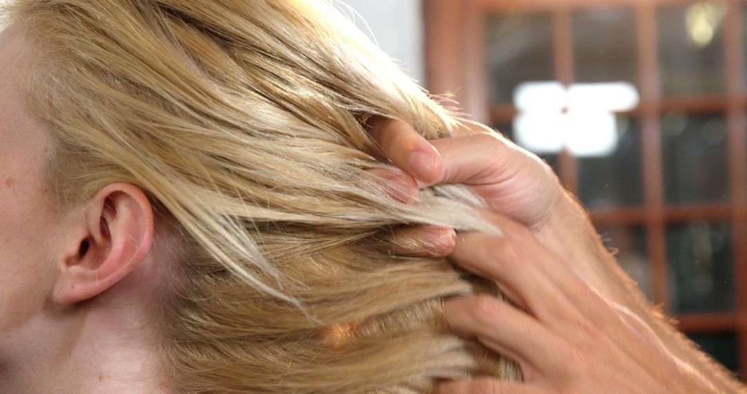 Hands Styling Blonde Hair, Close-Up View - Free Images, Stock Photos and Pictures on Pikwizard.com