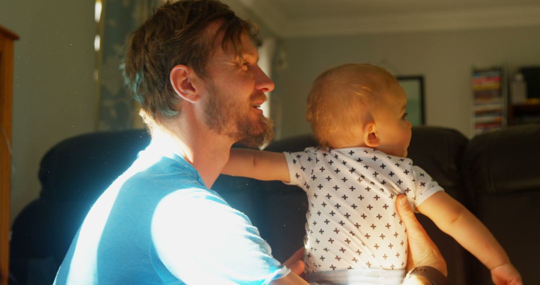 Father Enjoying Quality Time with Toddler in Sunlit Living Room
