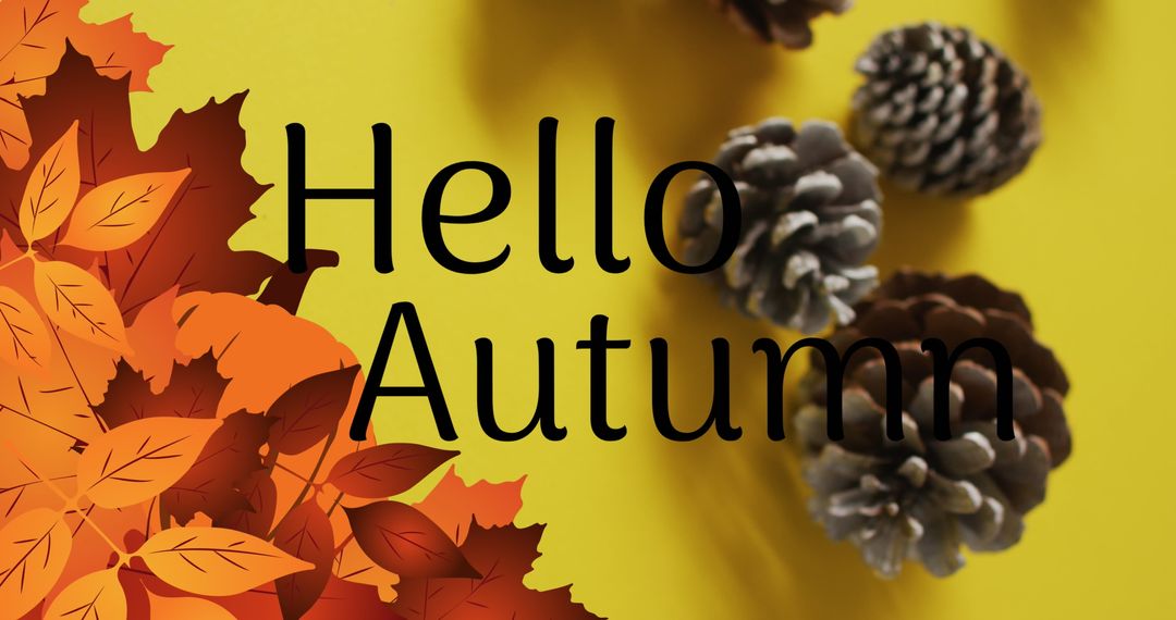 Hello Autumn Text with Pine Cones and Leaves on Yellow Background