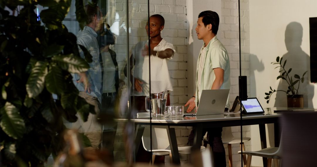 Diverse Professionals Innovating in Modern Office Setting