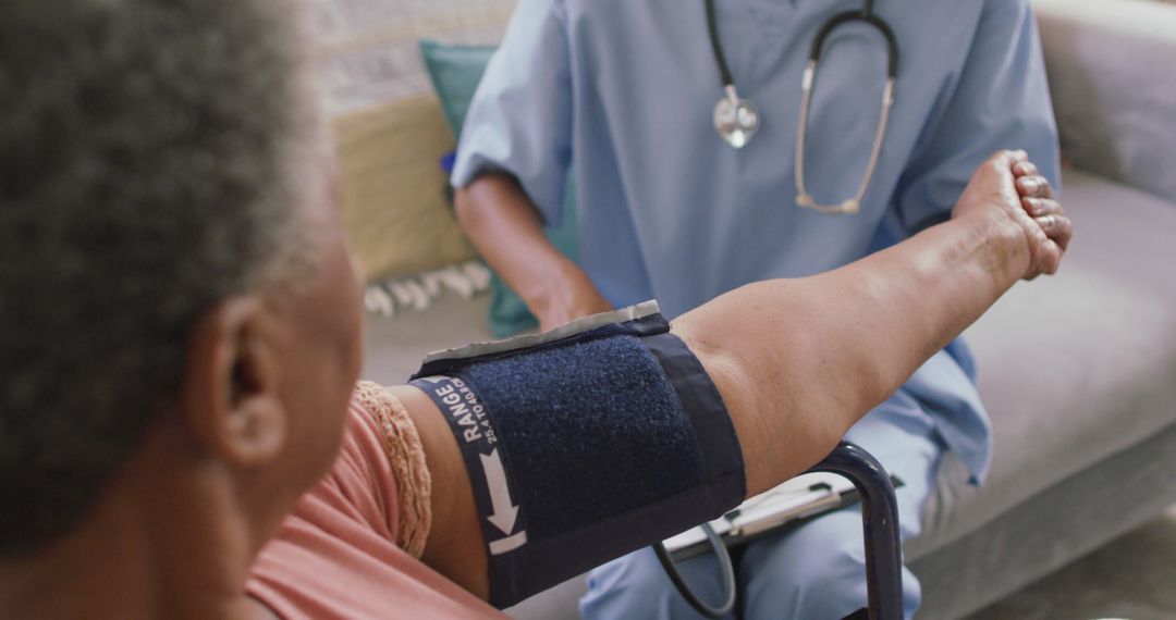 Nurse Measuring Blood Pressure of Elderly Patient at Home for Healthcare Checkup - Free Images, Stock Photos and Pictures on Pikwizard.com