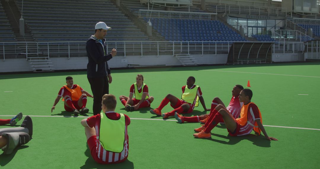 Soccer Coach Giving Team Strategy Talk During Training Session - Free Images, Stock Photos and Pictures on Pikwizard.com